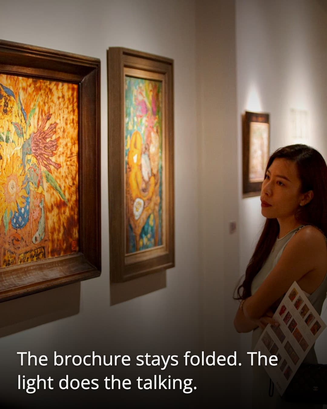 Annam Gallery visitor with brochure