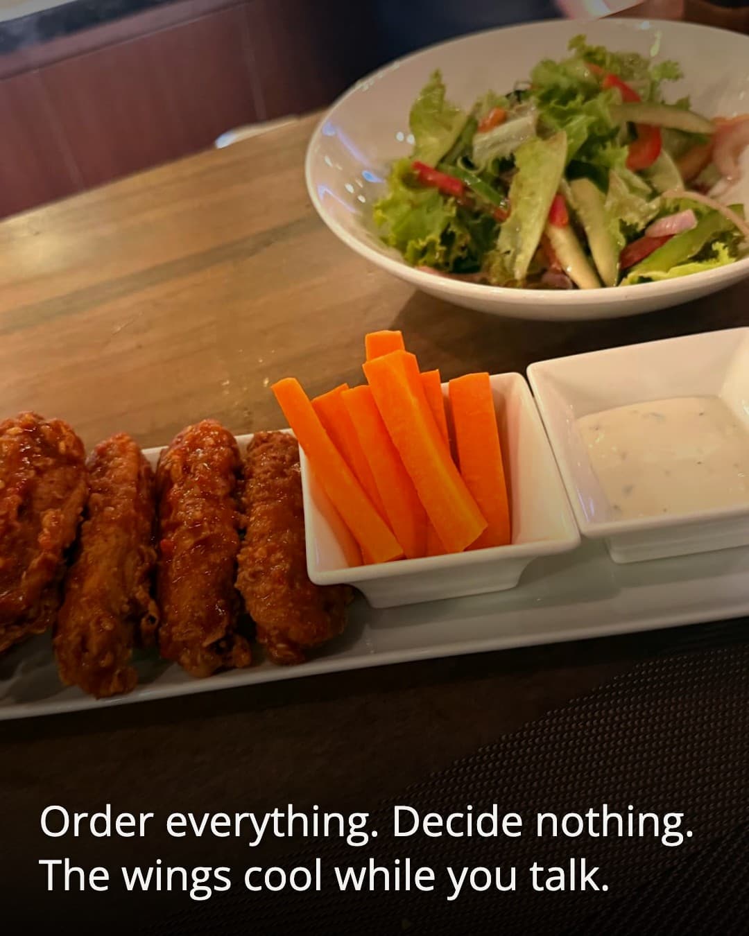 Mulligans Saigon fried wings and carrot sticks